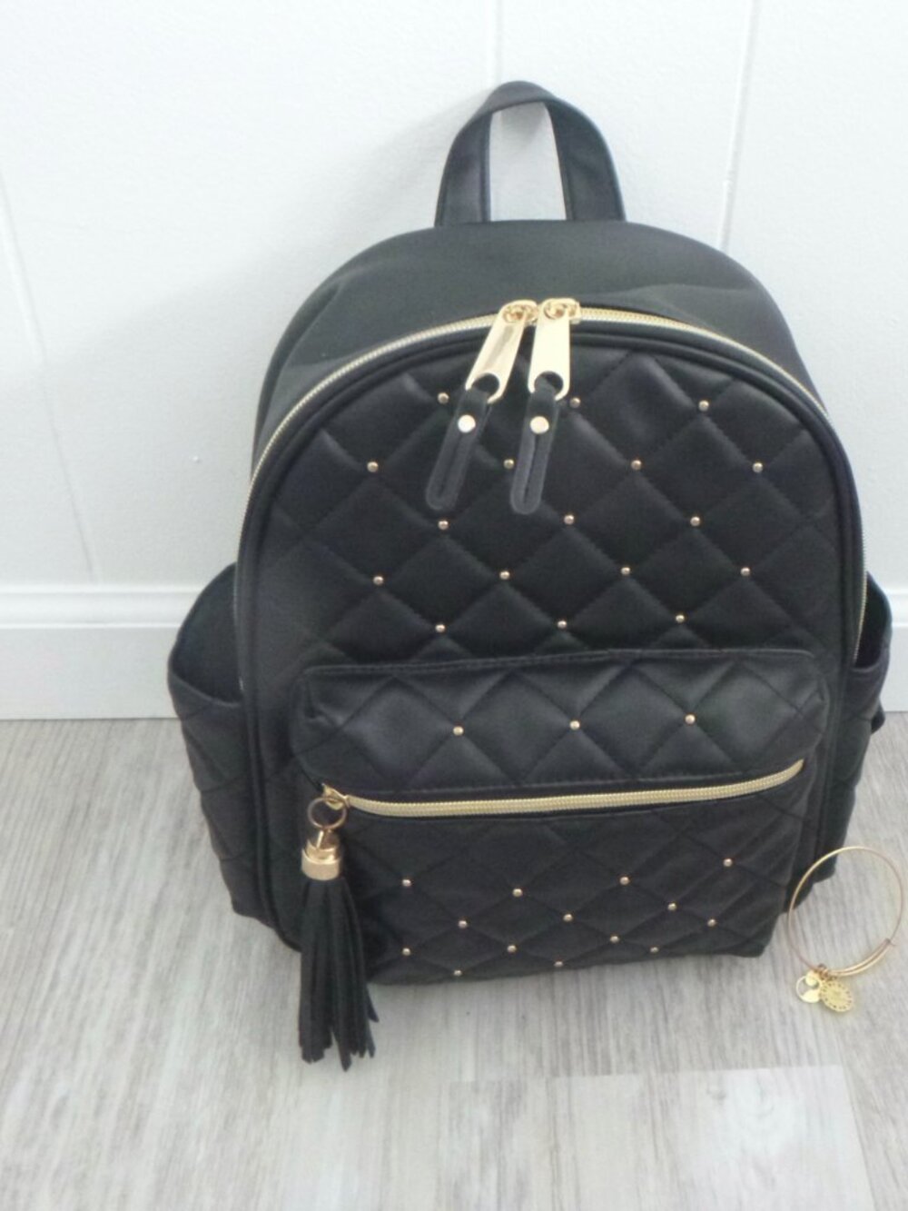 QUILTED BLACK BACKPACK GOLD STUDS & ZIPPER  LONG TASSLE  LOTS OF POCKETS
